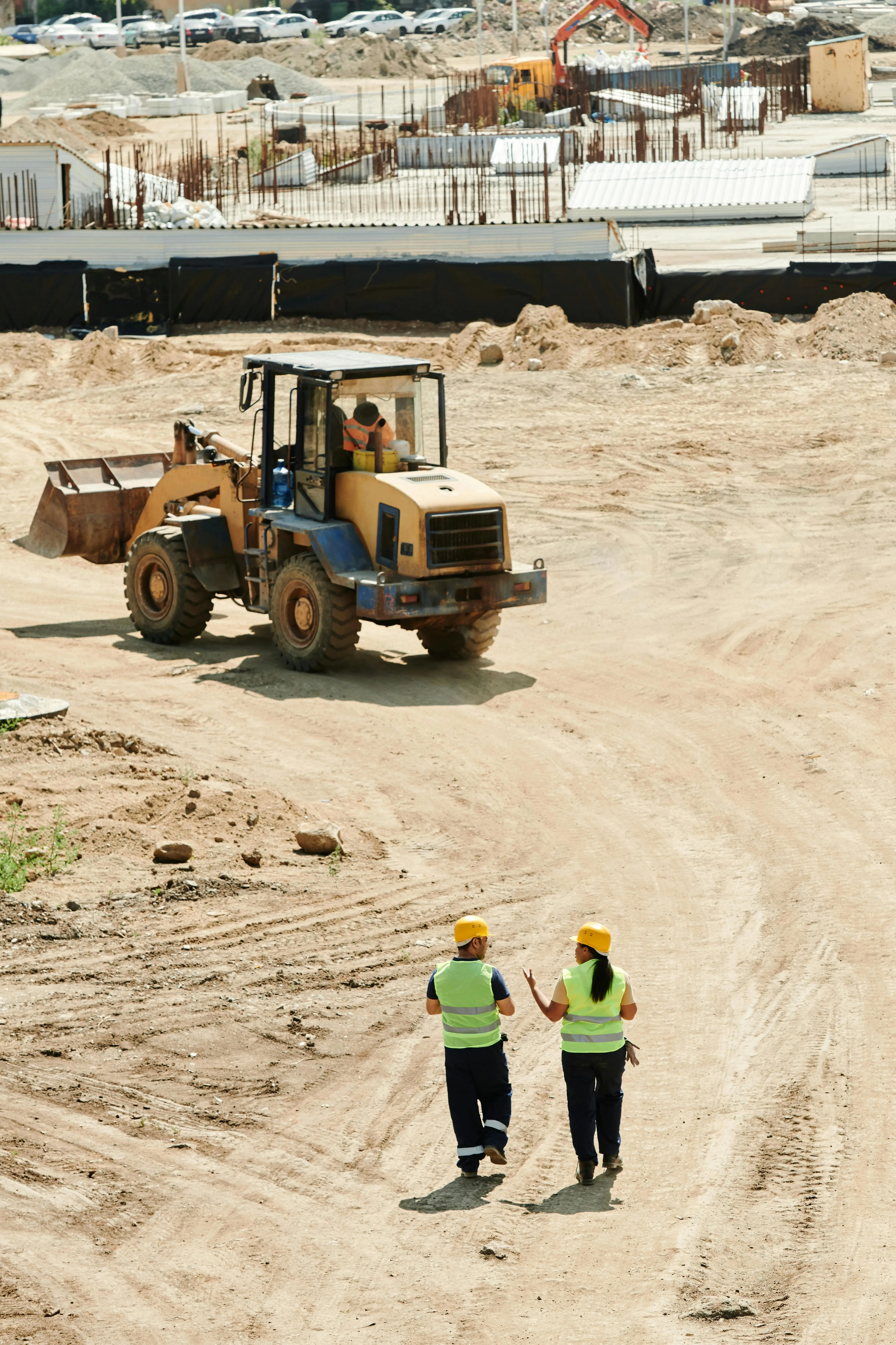 Construction Site with Workers and Machinery